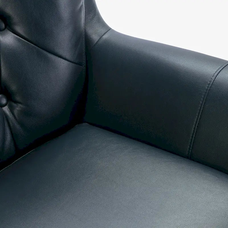 Fauteuil pivotant capitonné en similicuir