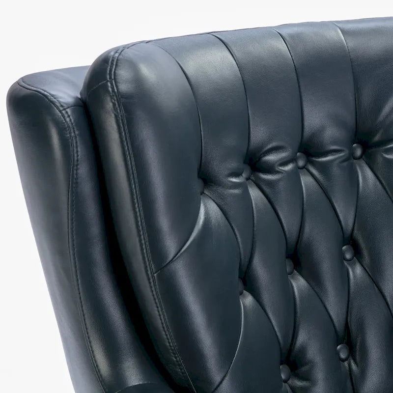 Fauteuil pivotant capitonné en similicuir