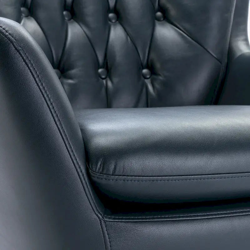 Fauteuil pivotant capitonné en similicuir