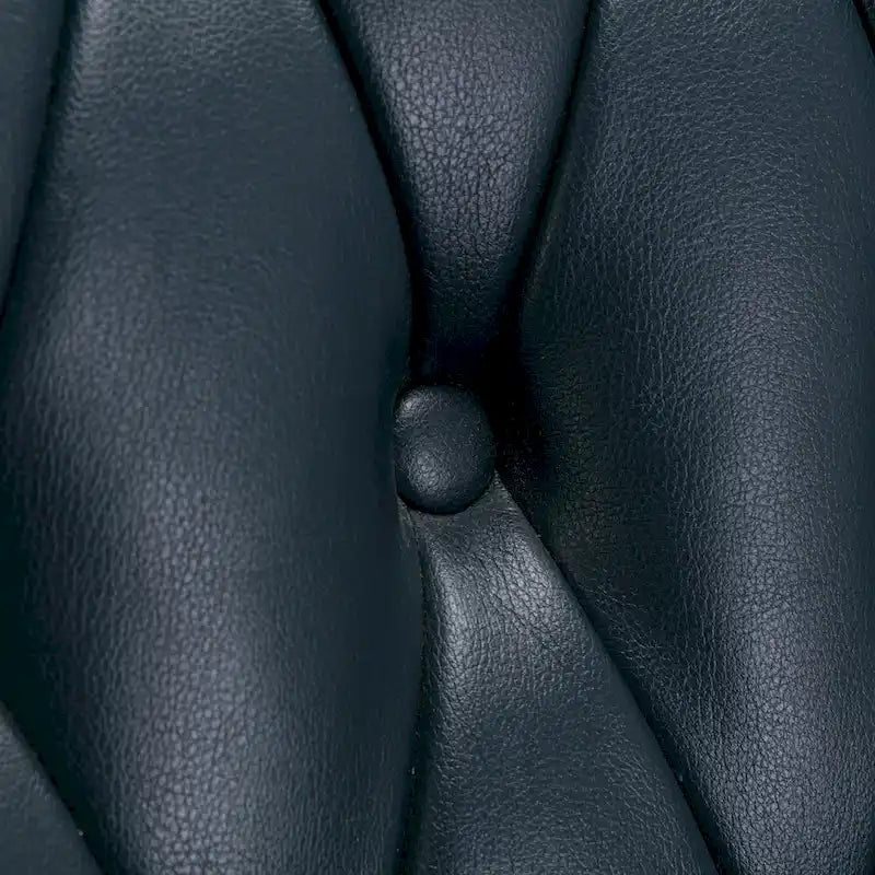 Fauteuil pivotant capitonné en similicuir